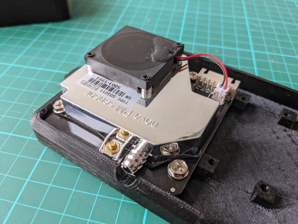 Photo of sensor screwed into case.