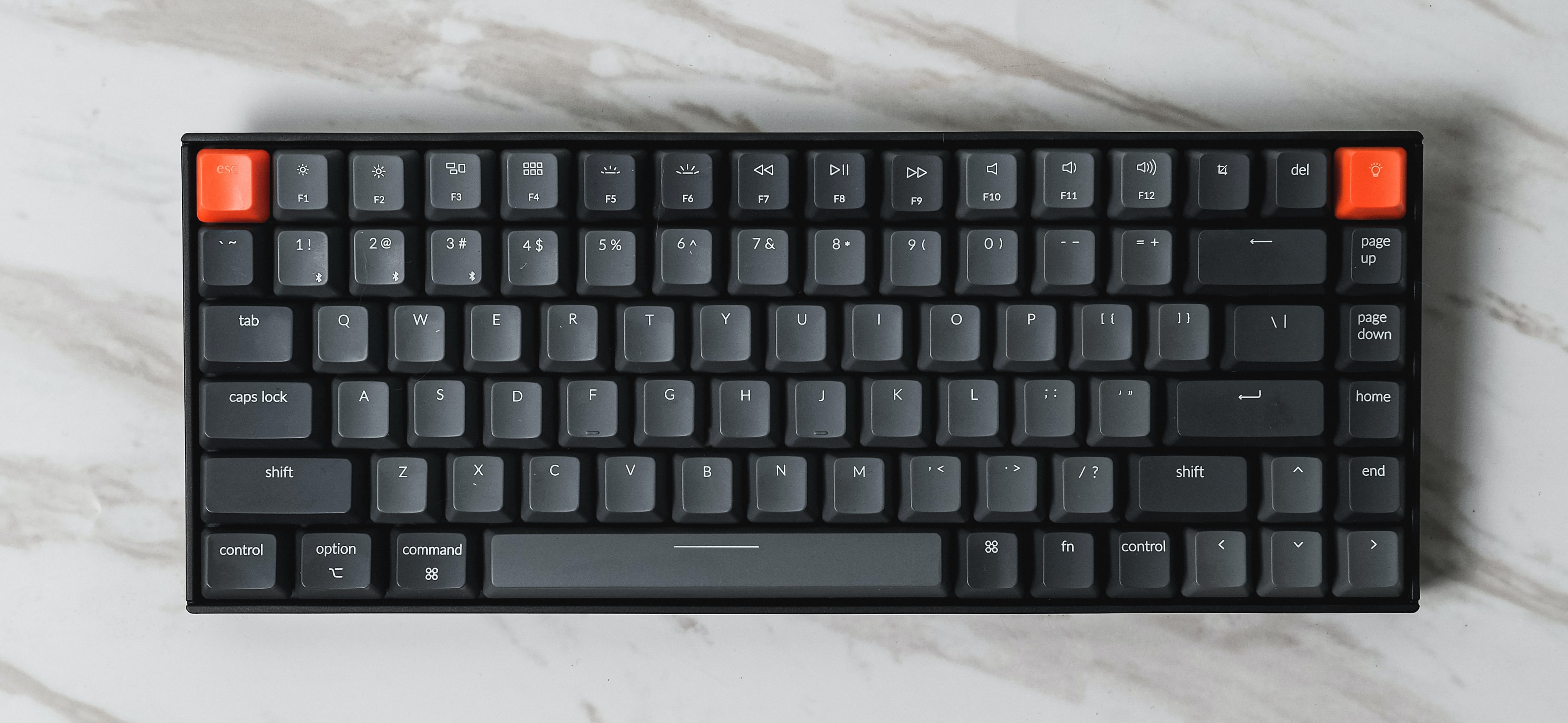 Black and orange keyboard photo by Stefen Tan